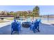 Community fire pit with plenty of seating and views of other neighborhood amenities at 2217 Holtwood Way, Apex, NC 27523