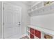 Organized mudroom with built-in shelving, coat hooks, and a convenient storage bench at 2217 Holtwood Way, Apex, NC 27523