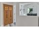 Hallway view into an office space featuring custom built-ins and a modern workspace at 2217 Holtwood Way, Apex, NC 27523