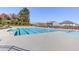 Well-maintained community pool with clear water, lounge chairs, and a surrounding fence for a safe and enjoyable experience at 2217 Holtwood Way, Apex, NC 27523