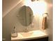 Well-lit attic bathroom featuring a modern sink, vanity, and mirror with towel rack at 2603 Red Pine Rd, Hillsborough, NC 27278