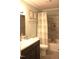 Well-appointed bathroom with a shower-tub combo, gray tile, and updated fixtures at 2603 Red Pine Rd, Hillsborough, NC 27278