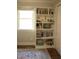 Built-in bookshelf offering plenty of storage, next to a bright window, for showcasing books and decor at 2603 Red Pine Rd, Hillsborough, NC 27278