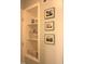 Hallway shelf and storage nook showcasing towels and other décor pieces at 2603 Red Pine Rd, Hillsborough, NC 27278