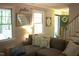 Bright living room with staircase, stylish decor, and a comfortable sectional sofa at 2603 Red Pine Rd, Hillsborough, NC 27278