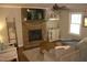Inviting living room features a brick fireplace, hardwood floors, and a ceiling fan at 2603 Red Pine Rd, Hillsborough, NC 27278