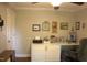 Well-lit office featuring a built-in desk, ample storage, and charming decorative artwork at 2603 Red Pine Rd, Hillsborough, NC 27278