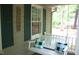 Cozy porch swing with pillows and a 'Welcome' sign creates an inviting outdoor space at 2603 Red Pine Rd, Hillsborough, NC 27278