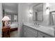 This bathroom has a vanity with stone countertop, with a bedroom view at 2616 Dockery Ln, Raleigh, NC 27606