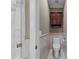 Bright bathroom featuring a toilet, vanity with cabinet, and tiled shower at 2616 Dockery Ln, Raleigh, NC 27606