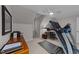 Bonus room with treadmill, workspace, neutral walls, and ceiling fan at 2616 Dockery Ln, Raleigh, NC 27606