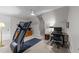 Bonus room with treadmill, workspace, neutral walls, and ceiling fan at 2616 Dockery Ln, Raleigh, NC 27606