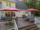 Spacious wooden deck with outdoor dining, seating, and a grill, perfect for entertaining at 2616 Dockery Ln, Raleigh, NC 27606