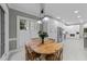 Cozy dining area features natural light, tile floors and an adjacent modern kitchen at 2616 Dockery Ln, Raleigh, NC 27606