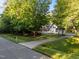 Beautiful home with a long driveway, mature trees, and a charming exterior at 2616 Dockery Ln, Raleigh, NC 27606