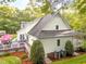 Exterior shot of a home with a large backyard, spacious deck and mature trees at 2616 Dockery Ln, Raleigh, NC 27606