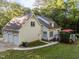 Charming home exterior with a two-car garage, a deck, and a well-maintained lawn at 2616 Dockery Ln, Raleigh, NC 27606