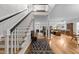 Grand foyer featuring a staircase, hardwood floors, and an open view to the living spaces at 2616 Dockery Ln, Raleigh, NC 27606