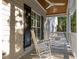 Cozy front porch with rocking chairs and porch swing, perfect for relaxation at 2616 Dockery Ln, Raleigh, NC 27606