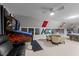 Large game room with pinball machines, a pool table, a seating area, and sports memorabilia displayed at 2616 Dockery Ln, Raleigh, NC 27606