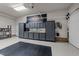Organized garage featuring storage cabinets and a Harley-Davidson decorative sign at 2616 Dockery Ln, Raleigh, NC 27606