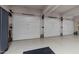 Spacious three-car garage with epoxy flooring and ample storage space at 2616 Dockery Ln, Raleigh, NC 27606