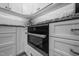 Kitchen features stainless steel Miele oven, subway tile backsplash, granite countertops, and white cabinets at 2616 Dockery Ln, Raleigh, NC 27606
