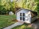 A charming backyard storage shed with a rustic design and ample storage space at 2616 Dockery Ln, Raleigh, NC 27606