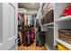 Organized walk-in closet with shelving and hanging rods for ample storage at 2616 Dockery Ln, Raleigh, NC 27606