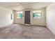 Unfinished basement with painted block walls, concrete floor, and two windows at 2670 Nc 210 S, Lillington, NC 27546