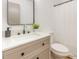 Bathroom vanity with a framed mirror, stylish fixtures, and a shower with a white curtain at 2670 Nc 210 S, Lillington, NC 27546