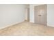 Bedroom with neutral carpet, closet with gray doors, and an open doorway at 2670 Nc 210 S, Lillington, NC 27546