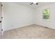Bright bedroom featuring neutral carpet and a window with a pleasant outside view at 2670 Nc 210 S, Lillington, NC 27546