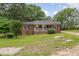 Charming brick home with a welcoming front porch and freshly cut lawn at 2670 Nc 210 S, Lillington, NC 27546