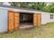 The exterior of the garage features an open doorway leading to the unfinished interior at 2670 Nc 210 S, Lillington, NC 27546