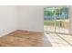 Bright living space with wood floors and sliding glass doors to a deck at 2670 Nc 210 S, Lillington, NC 27546