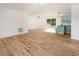 Inviting living area with open floor plan with lots of natural light and new flooring at 2670 Nc 210 S, Lillington, NC 27546