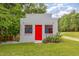 Grey outbuilding with red door and window frames at 2670 Nc 210 S, Lillington, NC 27546