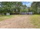 View of the home, shed, and ample surrounding yard space at 2670 Nc 210 S, Lillington, NC 27546