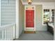 Charming front porch with a red door featuring the house number and a 'welcome' mat at 2720 Snowy Meadow Ct, Raleigh, NC 27614