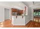 Elegant kitchen area with rich wooden cabinets, granite countertops and stainless steel appliances at 2720 Snowy Meadow Ct, Raleigh, NC 27614