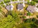 A private backyard backing up to trees and featuring a ground level deck at 2910 Reynolda Cir, Durham, NC 27712