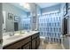 Well-lit bathroom features double vanity, countertop, decorative lighting and modern decor at 2910 Reynolda Cir, Durham, NC 27712