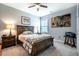 Comfortable bedroom features ceiling fan, large bed frame and modern decor and lighting at 2910 Reynolda Cir, Durham, NC 27712