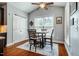 Cozy dining area with hardwood floors, natural light, and vaulted ceiling at 2910 Reynolda Cir, Durham, NC 27712