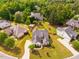 Stately home showcasing a sprawling lawn, mature trees, and manicured landscaping at 2910 Reynolda Cir, Durham, NC 27712