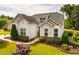 Attractive single-story home featuring stone accents and manicured landscaping at 2910 Reynolda Cir, Durham, NC 27712