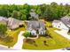 Stunning traditional home showcasing manicured lawn and landscaping, with a long private driveway at 2910 Reynolda Cir, Durham, NC 27712