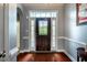 Elegant foyer with hardwood floors and a decorative glass front door at 2910 Reynolda Cir, Durham, NC 27712
