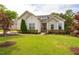 Beautiful home with stone accents and manicured landscaping in the front yard at 2910 Reynolda Cir, Durham, NC 27712